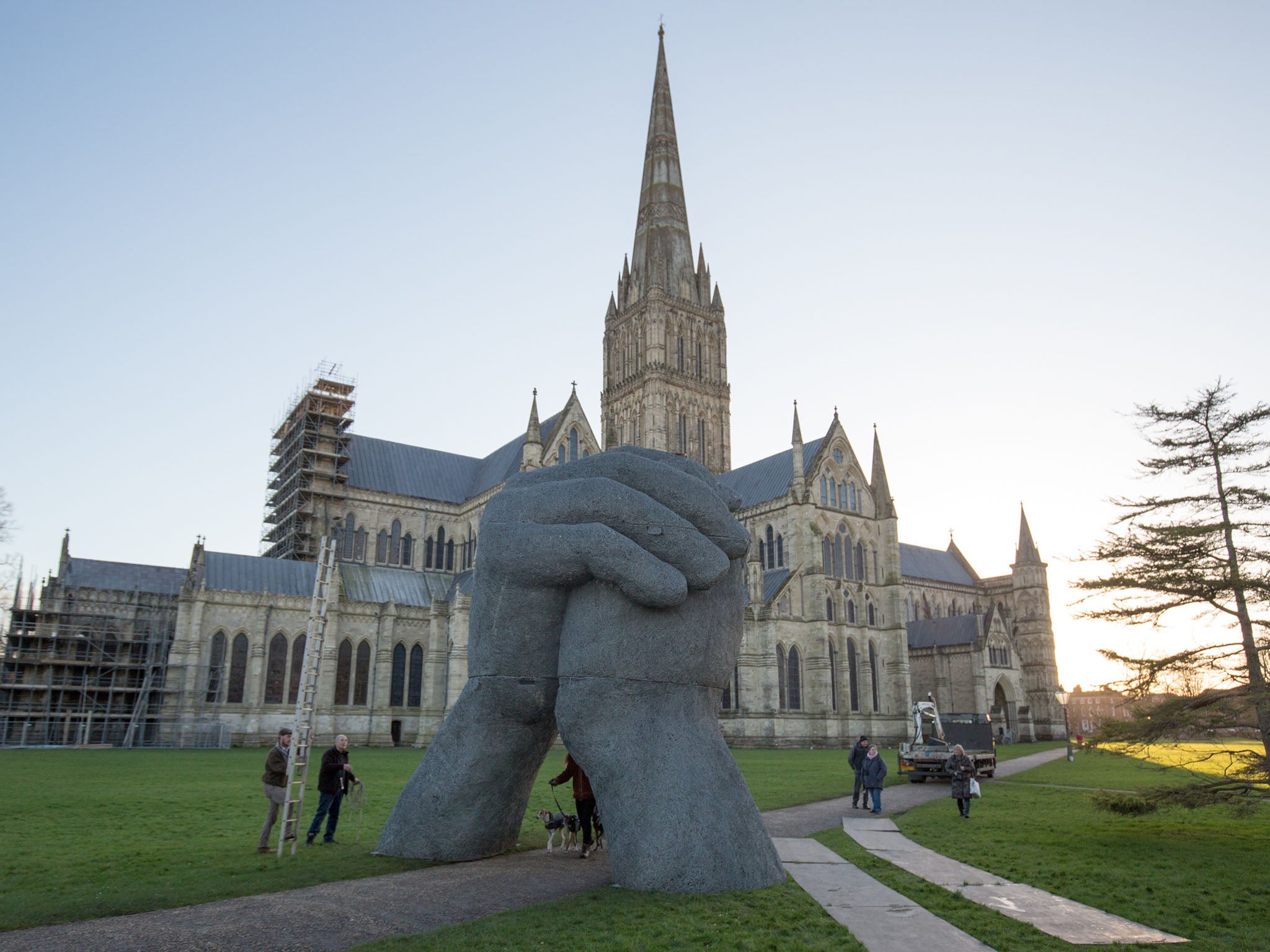 Giant sculpture moved from walkway as mobile phones users keep bumping their heads